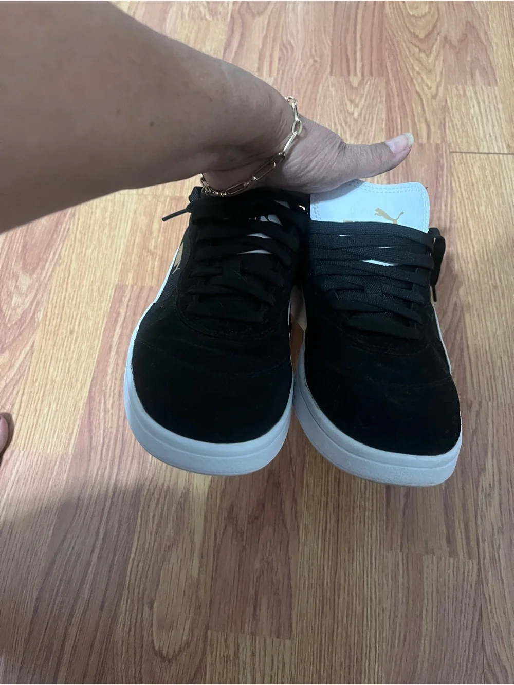 Puma Black Suede Sneakers with White Tongue and Gold Logo